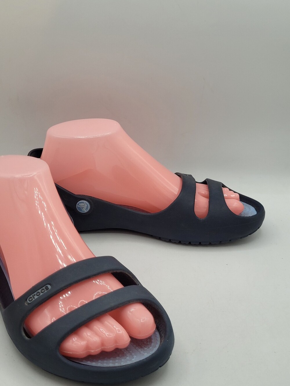 navy blue Crocs Cleo sandals featuring a double-strapped slingback design Size 9